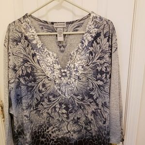 Blue and gray shirt.